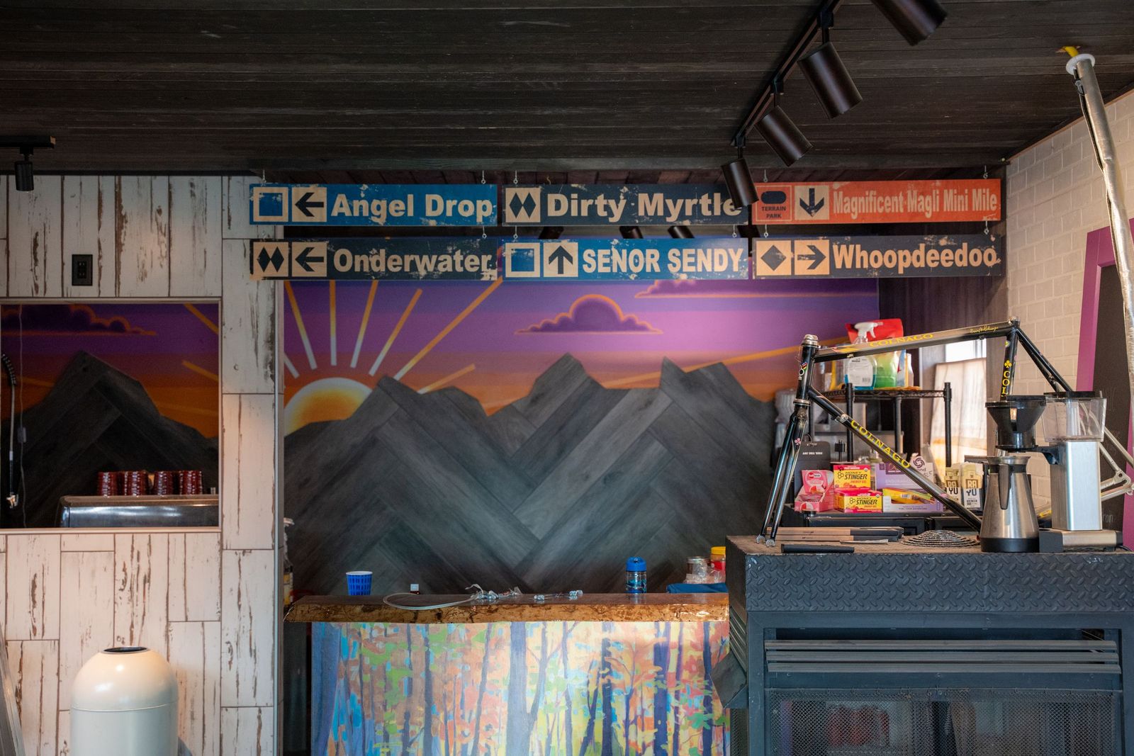 The Grumpy Goat coffee bar and mountain sunset mural